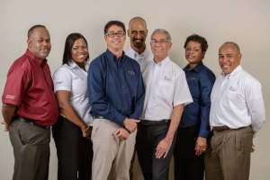 From Left: Mr. Hugh Allen, Resolution Manager and Executive Director; Mrs. Natalya Petrekin, Service Desk Manager; Mr. Norman Chen, Technical Services Director; Mr. John Gibson, Senior IT Security Officer; Mr. Edward Alexander, CEO; Mrs. Hortense Gregory-Nelson, Finance and Administrative Manager; Mr. G. Christopher Reckord, Sales and Marketing Director. Mr. Omar Bell.